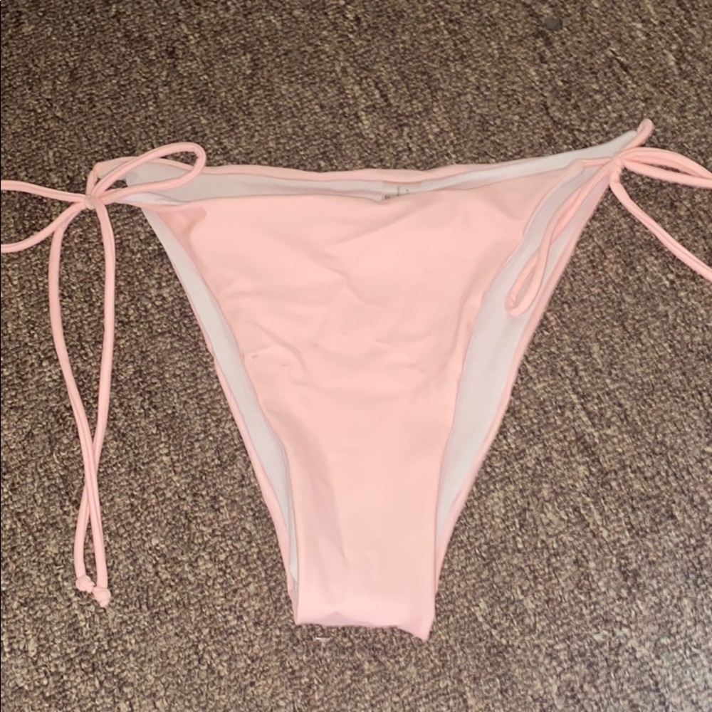 Pastel pink baiting suit bottoms cheeky